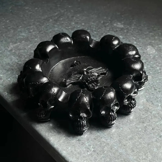 Versatile Gothic-style tray with a circular skull motif, usable as both a jewelry holder and ashtray, ideal for lovers of dark, punk, and gothic decor.